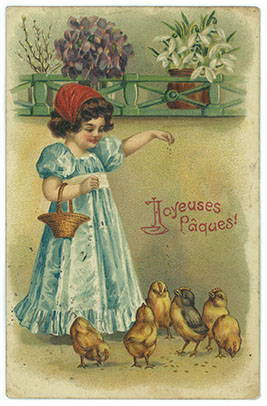 Petite fille nourrissant des poules